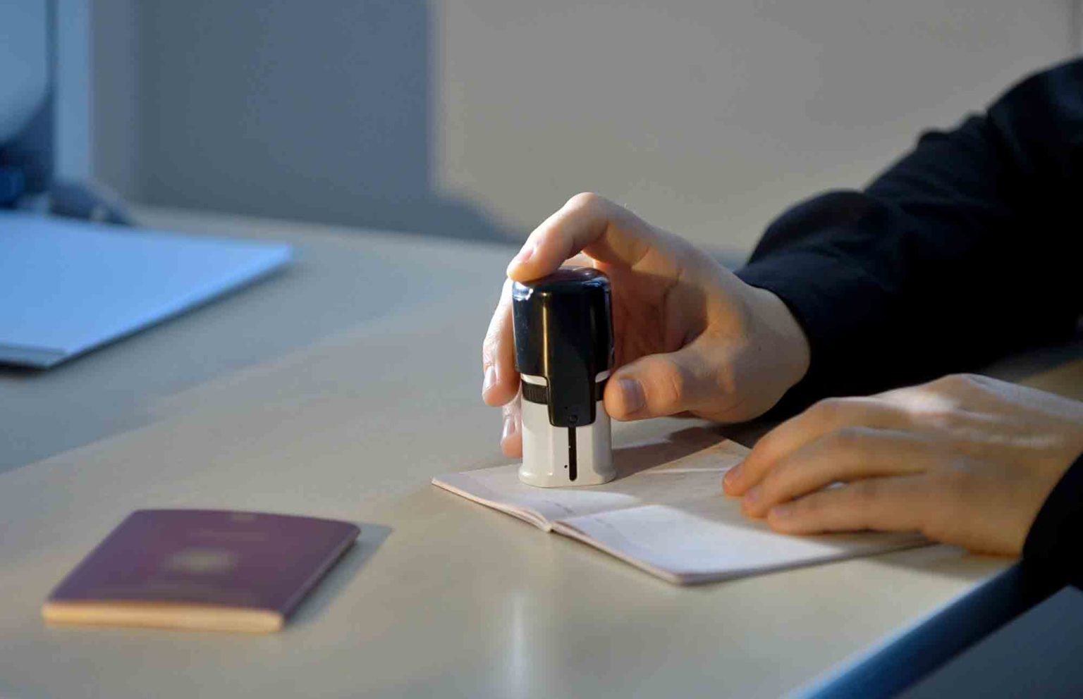 Customs Officer Stamping a Passport Malayasia